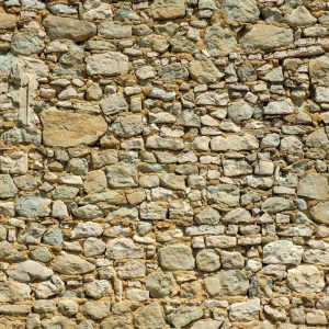 a stone wall made of small rocks