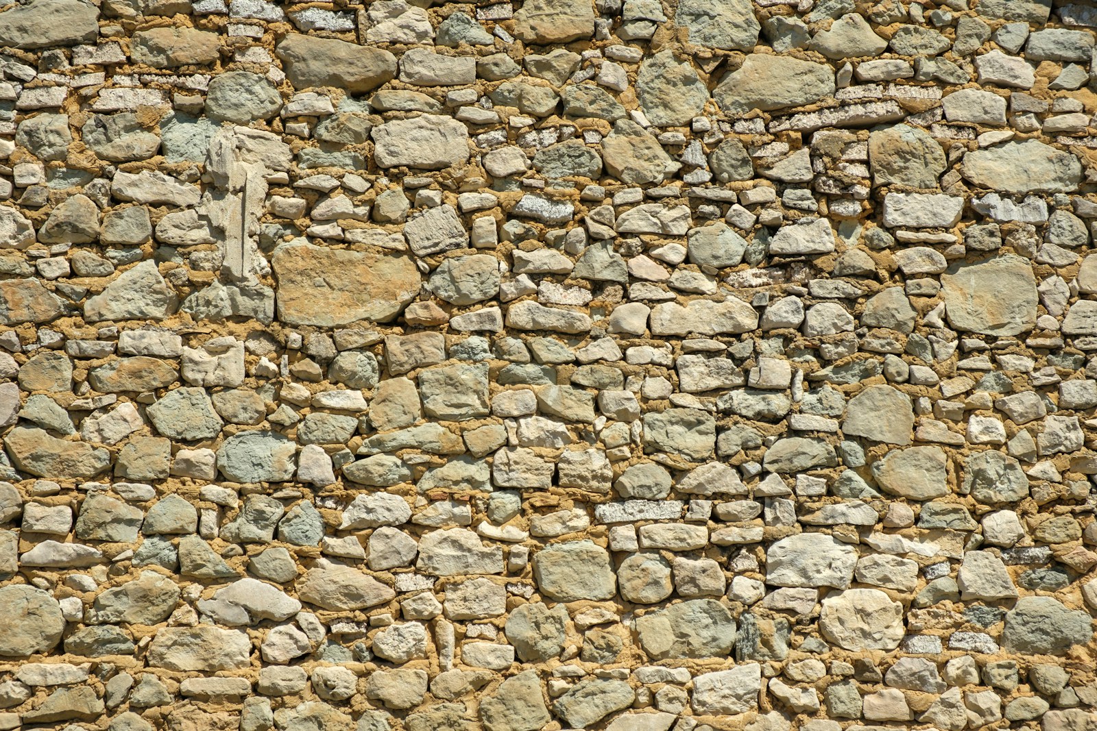 a stone wall made of small rocks